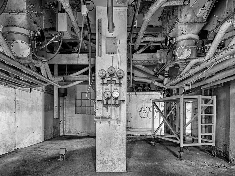 Fine art photograph of old machinery and pipes inside Bolands Mill in Dublin.