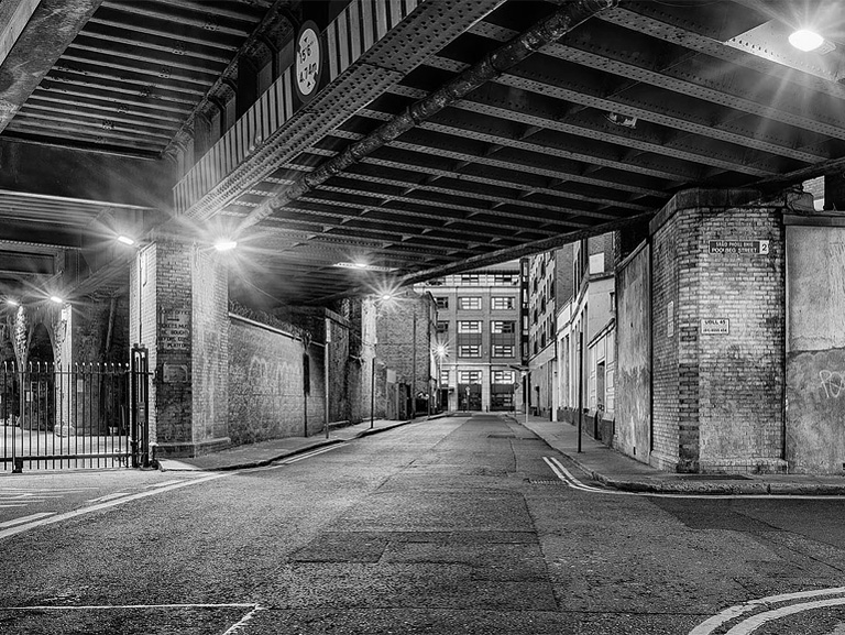 Fine art night photograph of a railway bridge in Dublin city centre, with its structure picked out by artificial light.