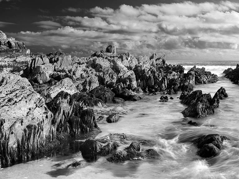 Fine art photograph of the rocky shore at Saint Finian’s Bay on the Ring of Skellig in County Kerry, with Atlantic waves and distant headlands.
