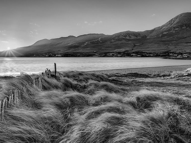 Black and white fine art photograph of Thornhill Strand with Croagh Patrick beyond in County Mayo