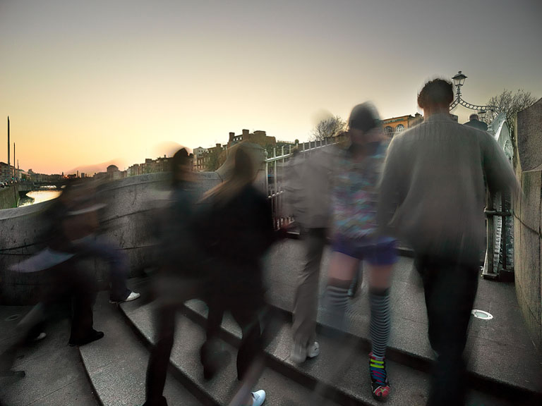 Fine art photograph of the Ha'penny Bridge over the River Liffey in Dublin with reflections of city lights