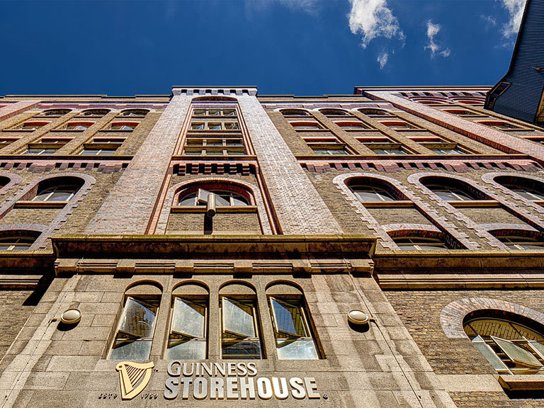 Brick facade of the Guinness Storehouse on Market Street in Dublin with strong vertical lines and soft light.