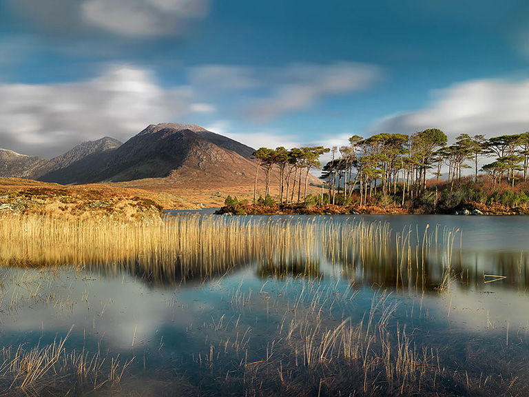 Long exposure landscape photograph of Derryclare Lough in Connemara, County Galway, with the Twelve Bens mountains in the background