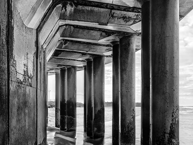 Fine art photograph of the New Brighton lighthouse and concrete sea wall at the mouth of the River Mersey on the Wirral.