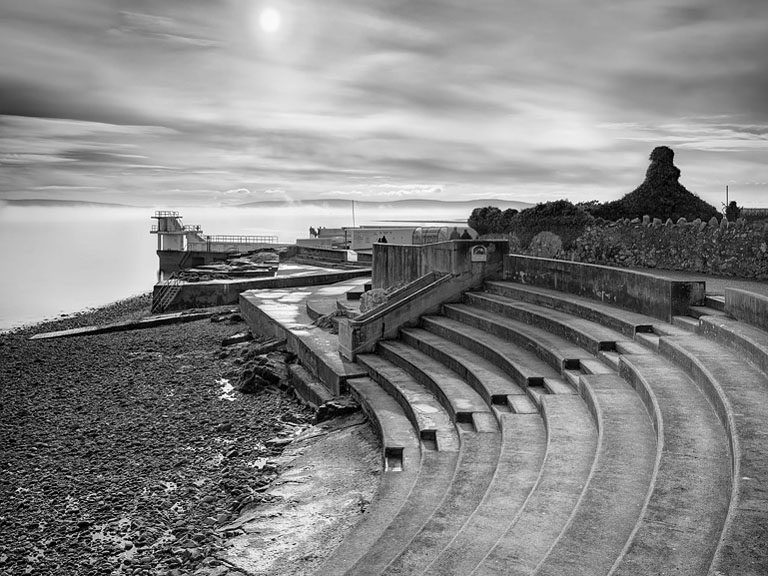 Fine art photograph of Blackrock Diving Tower over calm Galway Bay waters