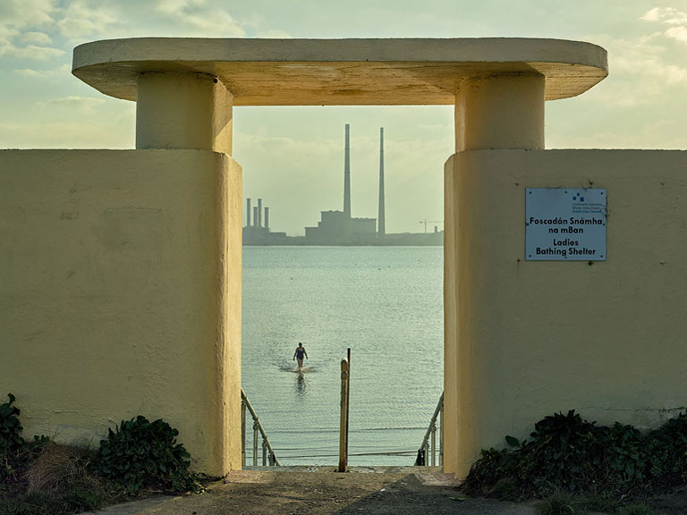 Fine art coastal photograph of a concrete bathing shelter on Bull Island looking out over Dublin Bay