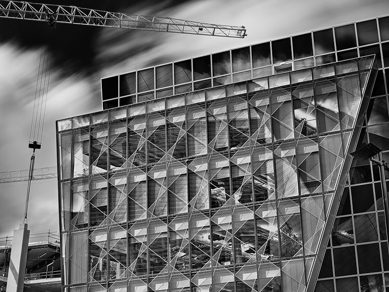 Contemporary interior at Grand Canal Dock in Dublin with glass, steel and angled surfaces, urban environment photograph