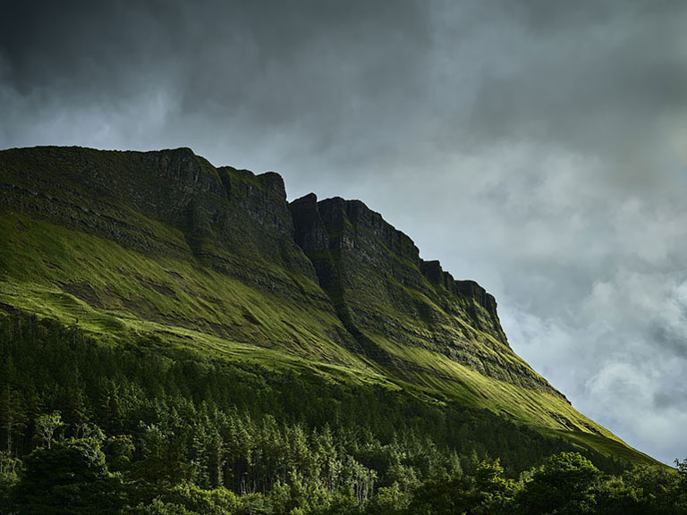 Fine art landscape photograph of Benwiskin mountain in County Sligo with strong sun and shadow on the slopes.