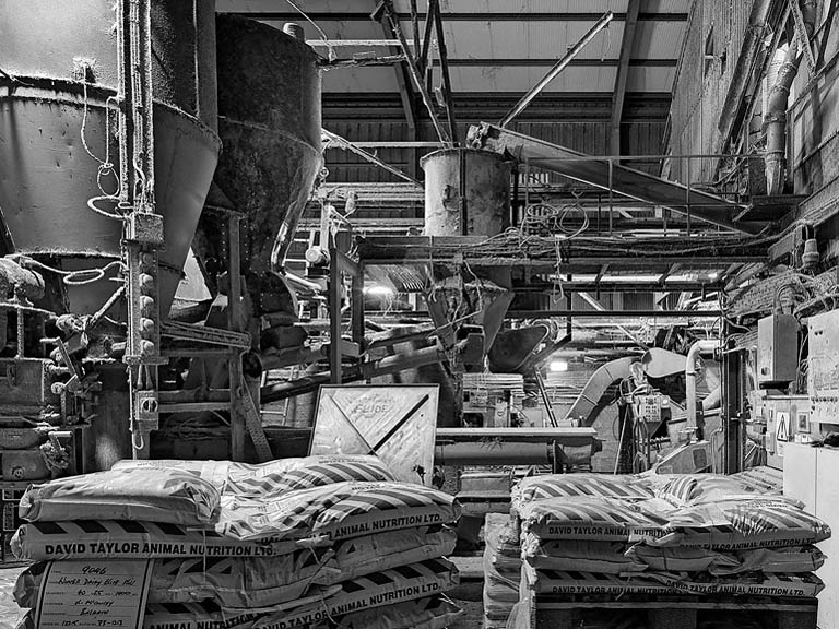 Coastal view along Keel Strand on Achill Island, with waves, beach and distant cliffs in soft light.