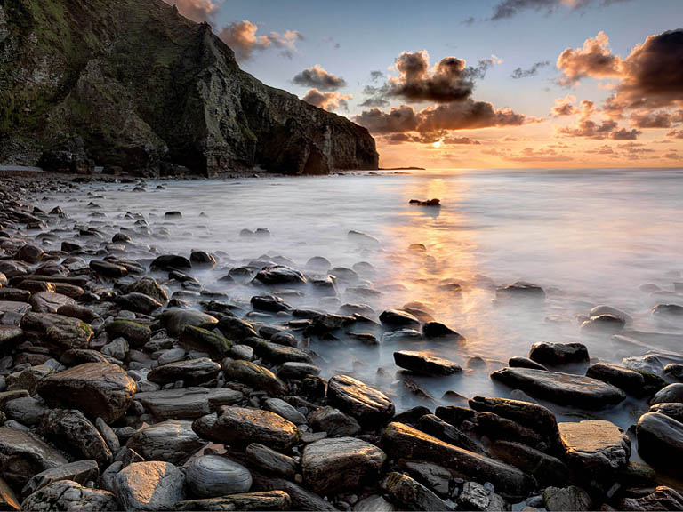 Calm waters of Killary near Leenane, framed by surrounding hills and soft atmospheric light.
