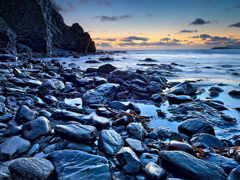 Wide view towards Keem Strand on Achill Island, with sweeping bay, beach and surrounding cliffs.