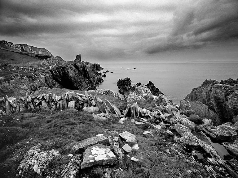 Black and white fine art photograph of O'Driscoll Castle at Dún an Óir on Cape Clear, overlooking the Atlantic Ocean